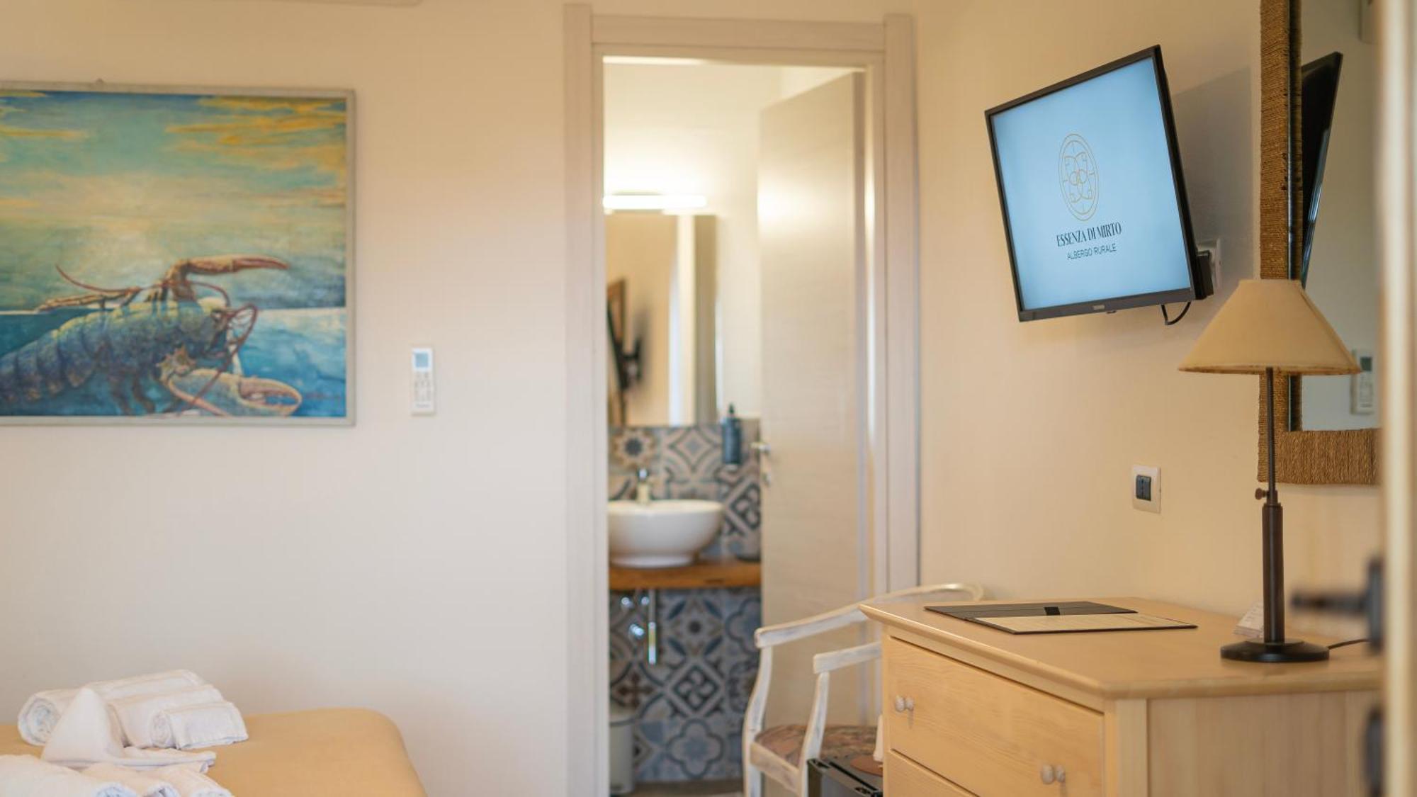 Hotel Essenza Di Mirto La Caletta Phòng bức ảnh