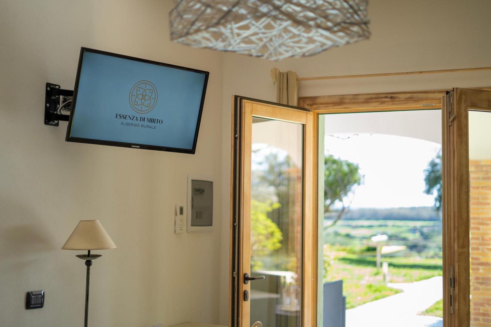 Hotel Essenza Di Mirto La Caletta Phòng bức ảnh