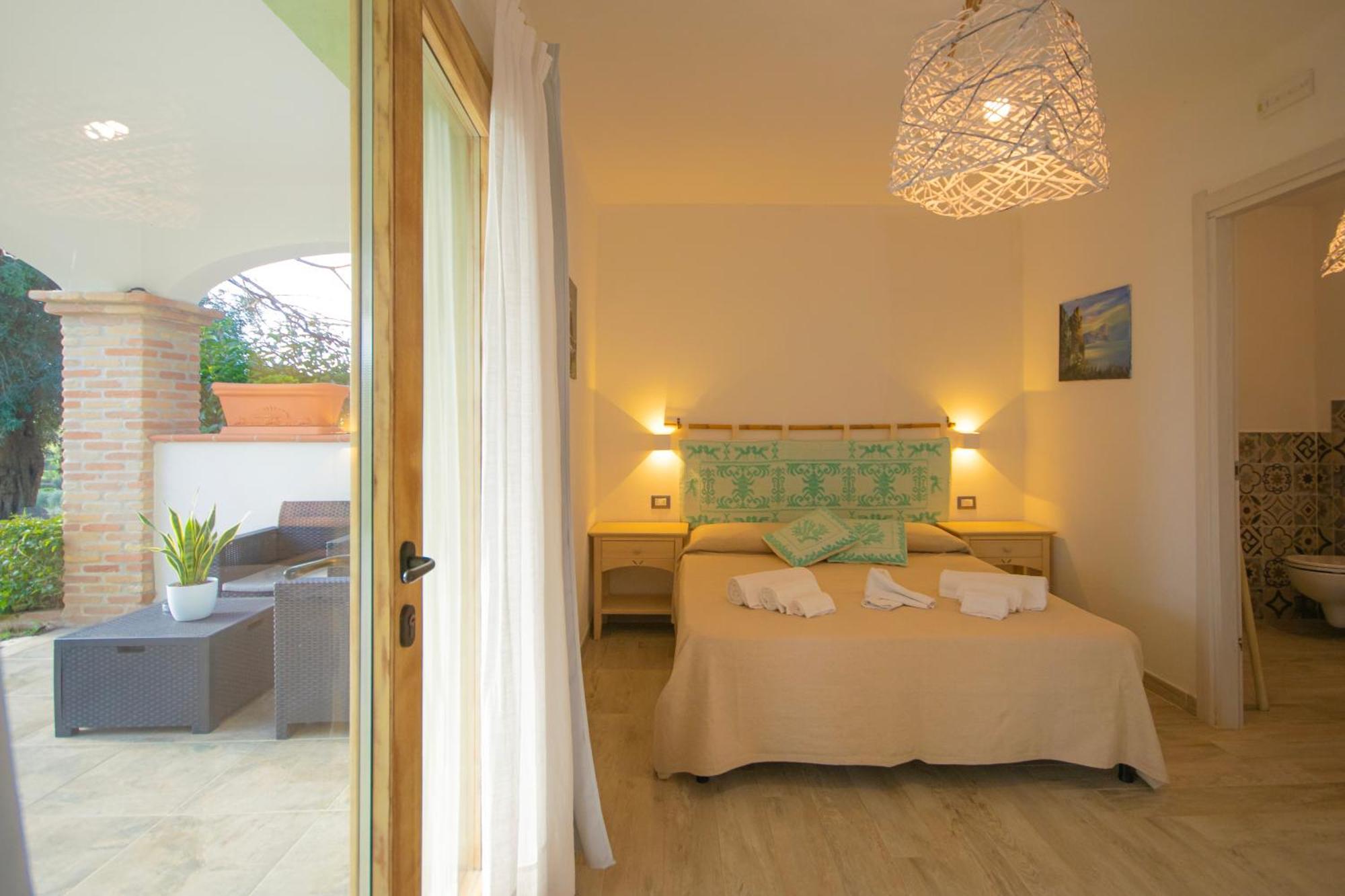 Hotel Essenza Di Mirto La Caletta Phòng bức ảnh